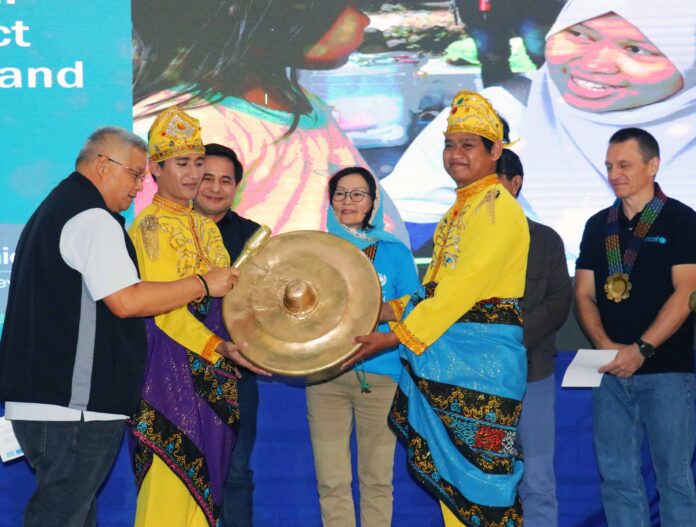 Lanao del Sur Governor Mamintal Alonto Adiong Jr. hits the gong, signaling the implementation of the 